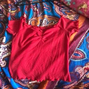 A red off the shoulders shirt